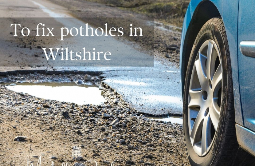Car on a road with a pothole 